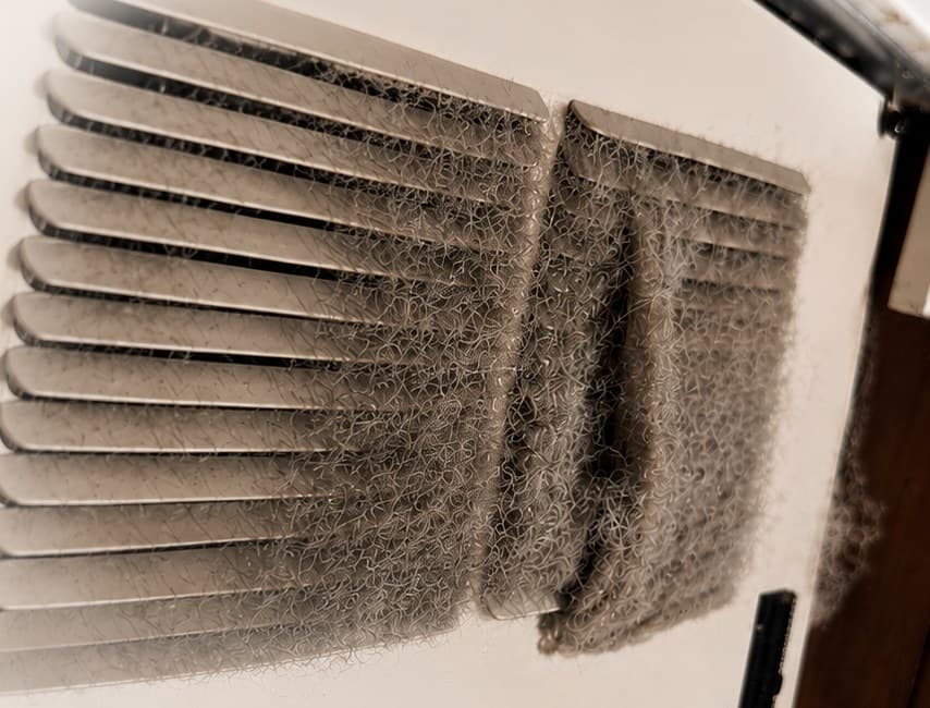 Sub-Zero condenser coils packed with dust before cleaning